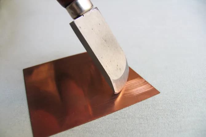 The rocker tipped slightly to one side, mid-rock, the textured band widening behind it.
